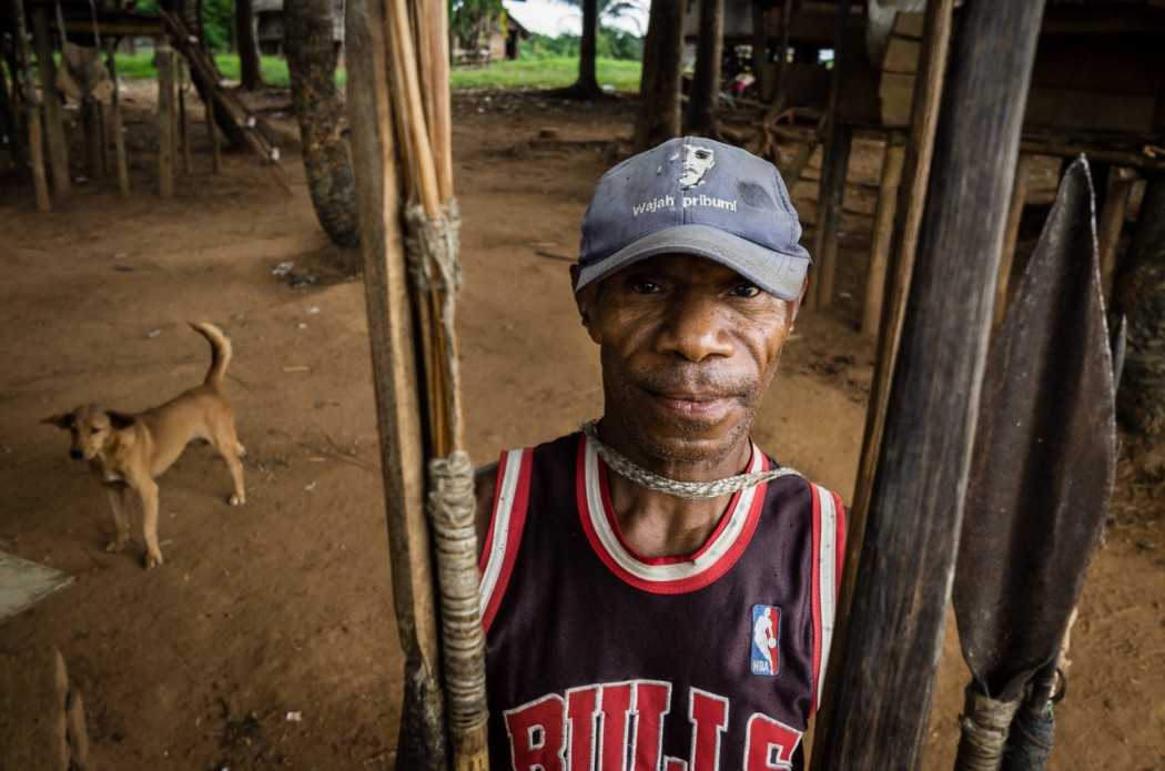 Yohanes Kame, 52, shows hunting tools that he said are now rarely used.