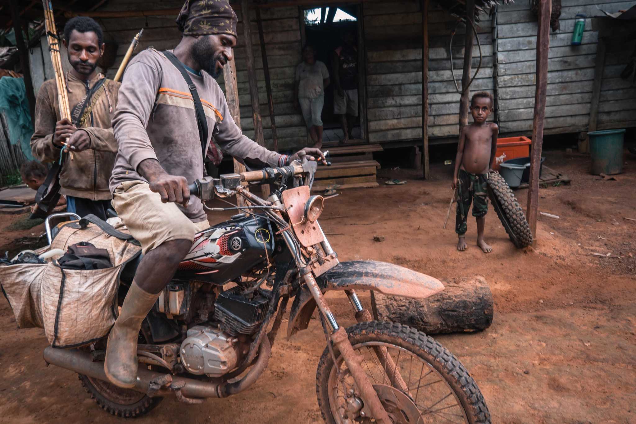 Photo of hunters using motorbikes to reach new hunting grounds, up to 16 kilometres away from the village. 